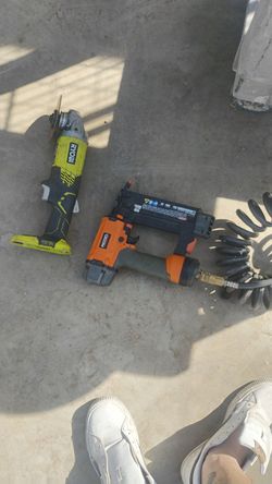 Ryobi Wireless Grinder With Battery And Charger And I Have The Nail Gun And I Have Two Tanks To Choose From Small Ones Once Portable DeWalt