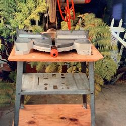 Table Saw On Wheels In Metal And Wood Shelf Below