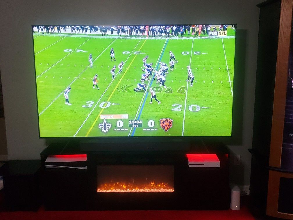 Samsung 85" TV Including Electrical Fire Place and Onn Surround Sound 5.1  System