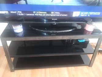 TV stand can hold up to a 65 inch flat screen TV