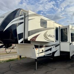 2013 voltage 42ft fifth wheel toy hauler with 3 slide triple axle