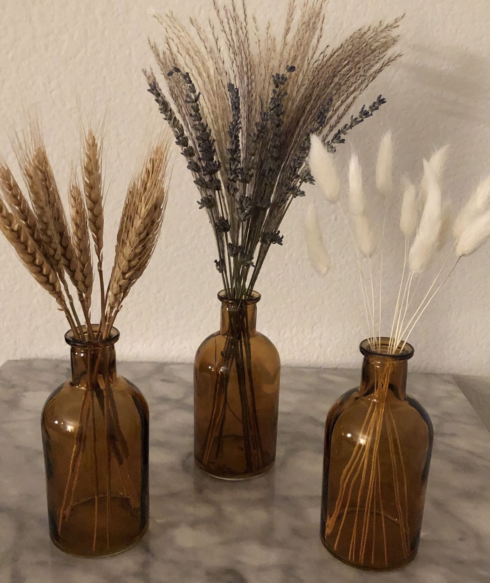 3 new decorative amber glass bottles with dried flowers