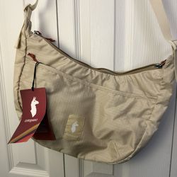 Cotopaxi Trozo 8L Shoulder Bag, specifically in the "Cream" or a light beige color. 