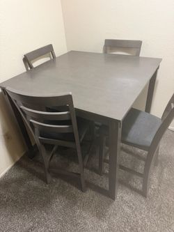 Ashley’s dining table grey color