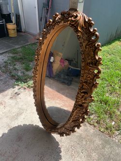 A wall mirror very old in good condition