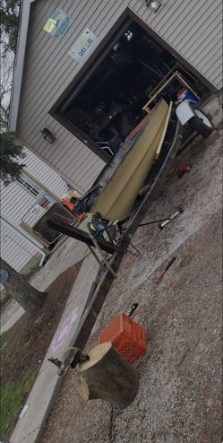 12 foot Jon boat (flat Bottom) and a 12-16ft adjustable trailer
