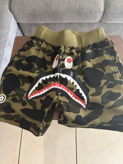 A Bathing APE green camo shorts