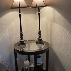 Round black table and two lamps