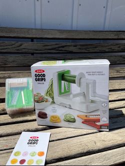 💥25% OFF💥 OXO Good Grips 3-Blade Tabletop Spiralizer, a white plastic kitchen tool with a hand crank and a suction-cup base designed to slice fruits