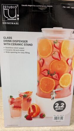 Glass drinking dispenser with ceramic stand