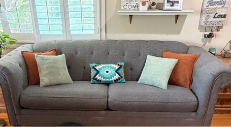 Gray Tufted Sofa with Nailhead Trim