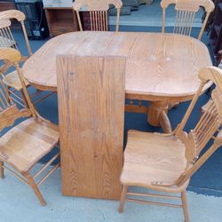 Wooden Kitchen table with leaf and 6 chairs