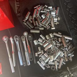Assorted stash of sockets and wrenches 