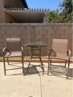 Selling two used tall outdoor chairs. Used condition. Selling two used tall outdoor chairs. Used condition