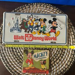 Vintage Walt Disney license plates (sealed) With Disney decals