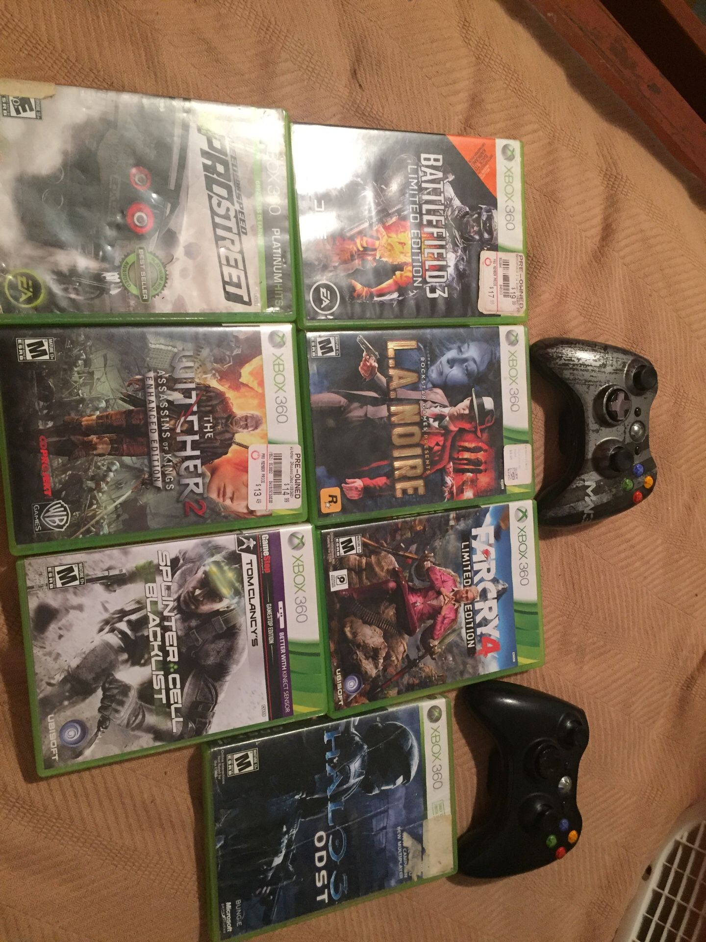 7 Xbox 360 games and 2 Xbox 360 controllers