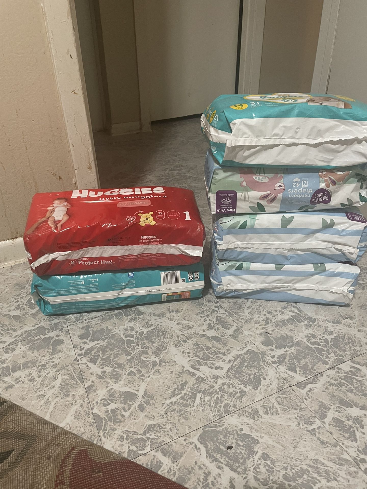 4 Packs Of Newborn &2 Packs Of Size 1