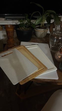 Four multi-size cutting boards in beautiful condition