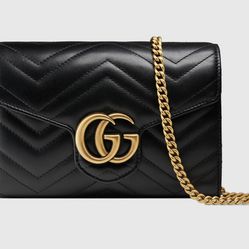 Black Gucci GG Marmont chain mini flap bag with Double G hardware