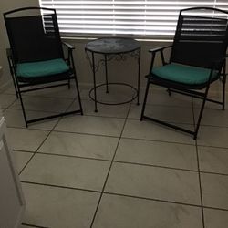 Very elegant two chairs with Rado round table, indoor or outdoor selling all three pieces with removable cushions for $40