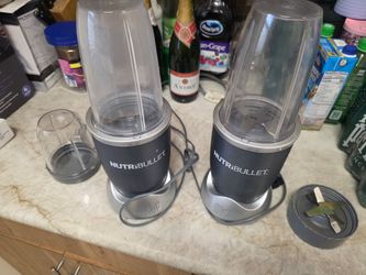 2 Nutribullets mixers with components