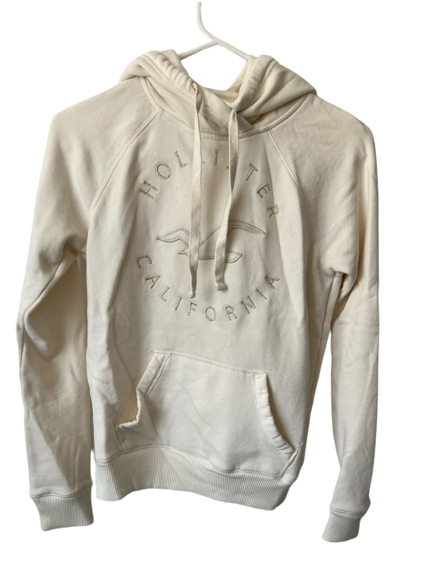 Hollister Ladies Cream Hoodie XS  Bird On Front Pullover   Comes from a pet and smoke free home.  Al measurements are in the pictures. This Hollister 