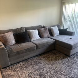 Sectional Couch, Pillows And Rug