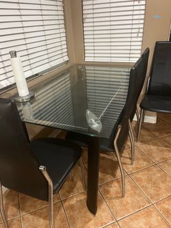4-person glass top with 4- chairs 45 inches dinning table