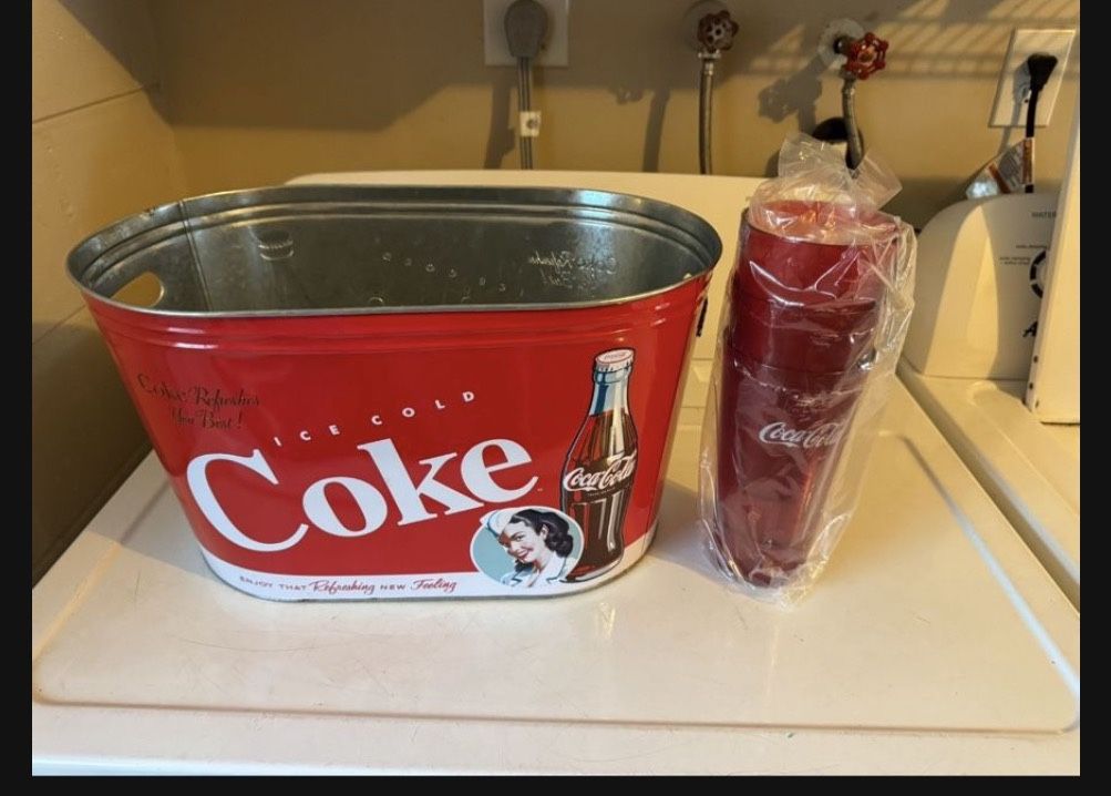 New condition, galvanized Coca-Cola tub with three new Coca-Cola tumblers And Three Foot Coke Bank