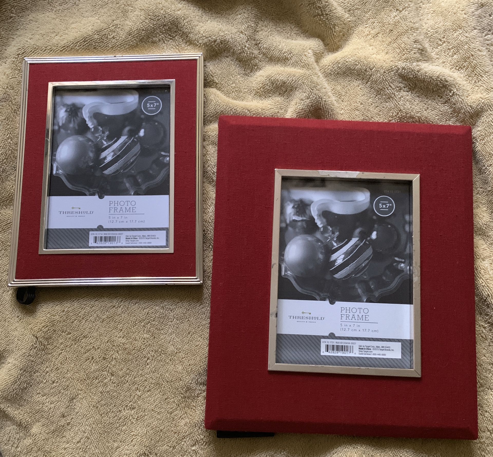 Two red velvet and silver frames