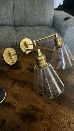 Gold swivel wall lights