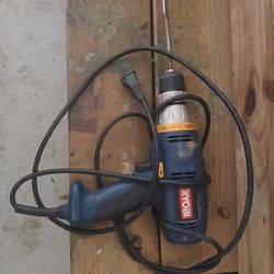Green Ryobi Powerdrill Corded with 1 drill bit