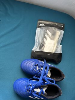 Royal Blue Youth Size 11 Soccer Cleats And Size Small Youth Shun Guards