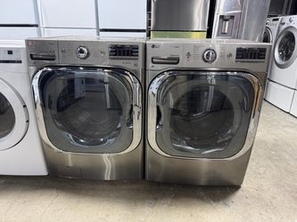 LG jumbo Stainless steel front load washer and gas dryer set