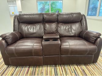 Brown Dual Reclining Loveseat with Console & Cup Holde
