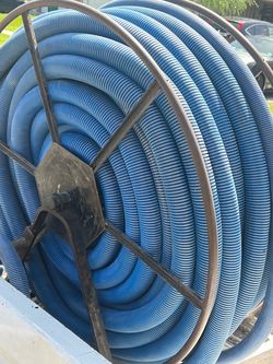 Carpet extractor hose and reel with wand