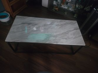 Simulated marble  top coffee table.
