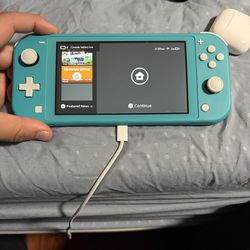 Nintendo switch lite teal with a  game and case