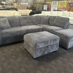 Gray Reversible Chaise Sectional And Ottoman 