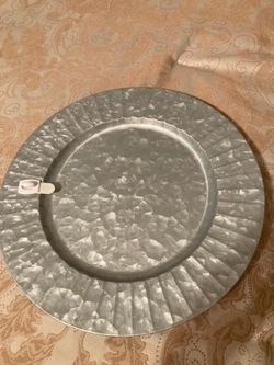 Silver plate  chargers displaying front & back of the charger