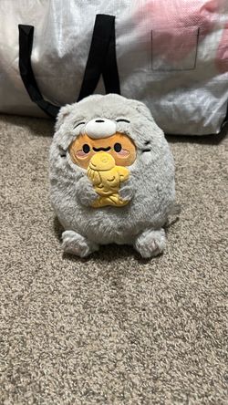 Round Gray Plush Toy Holding Fish Bread