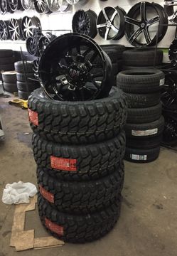 20x10 INCH WHEELS AND 33 MUD TERRAINS!!!! WE FINANCE!!