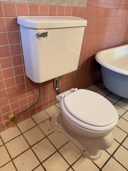 Vintage Two-Piece Ceramic Toilet with Chrome Flush Pipe