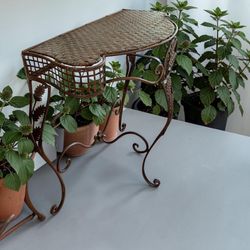 Wrought iron and wicker vintage table