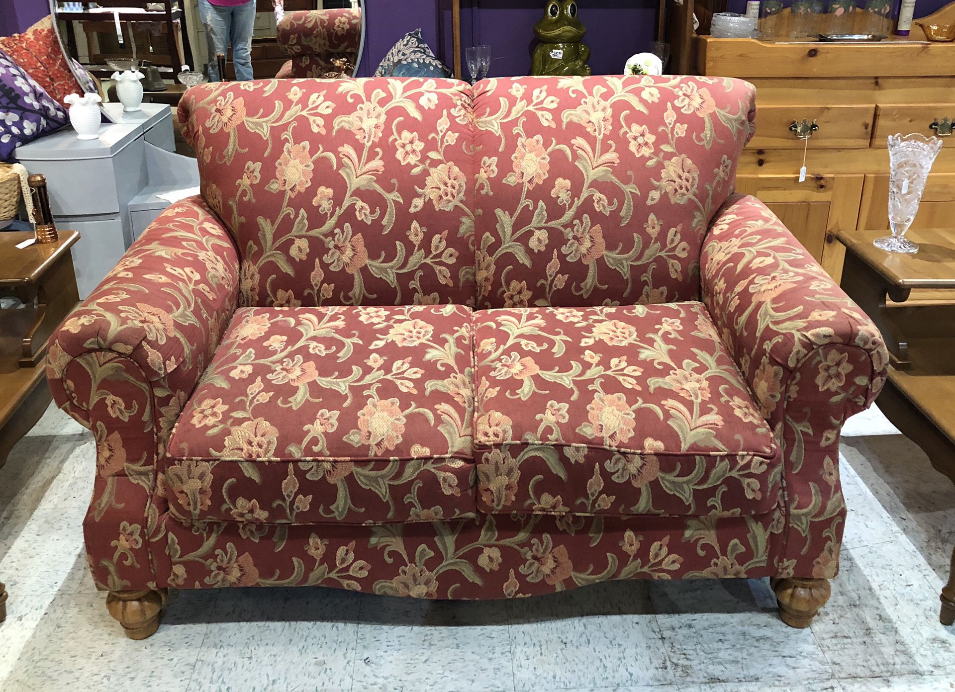 Rust/floral pattern love seat