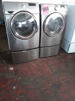 Samsung front load washer and dryer set with pedestals in excellent conditions