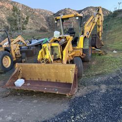 Backhoe John Deere 710b