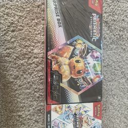 Brand new unopened Pokemon Prismatic Evolutions Suprirse box + Booster Bundle