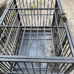 I Heavy duty dog cage got wheels to.  34 tall , 43long , 30 wide $85 Located Mount Dora Fla 32757