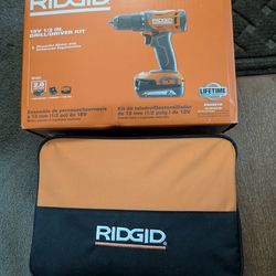 1/2-In rigid drill battery charger and carrying case.  This item is brand new